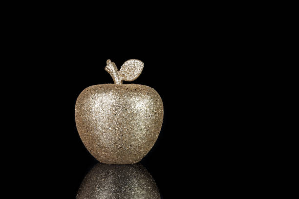 Wet apple in abstract lighting.