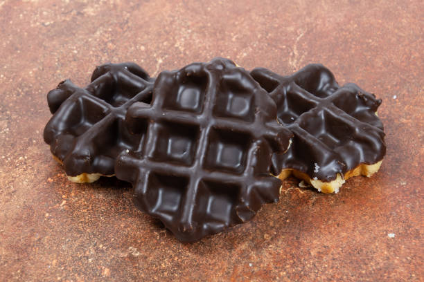 istock Close-up of chocolate waffles on a table 1444951243