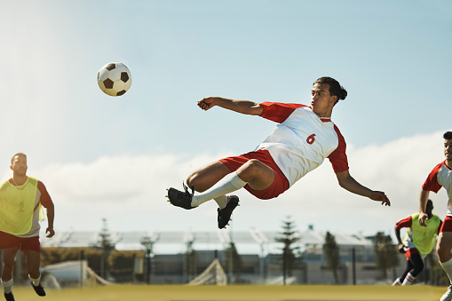 Sport rivals in motion. Banner with american football players during the match playing, compete in chasing the ball on stadium. Concept of rivalry, competition, leadership, activity, ad