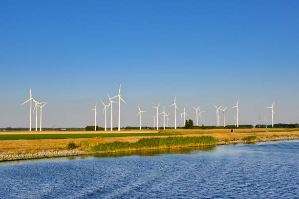 istock Tall wind turbine against a deep blue sky 1444957448
