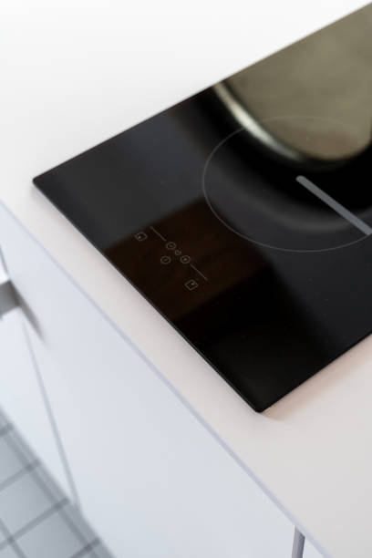 istock modern electrical stove at kitchen with light furniture 1444959136