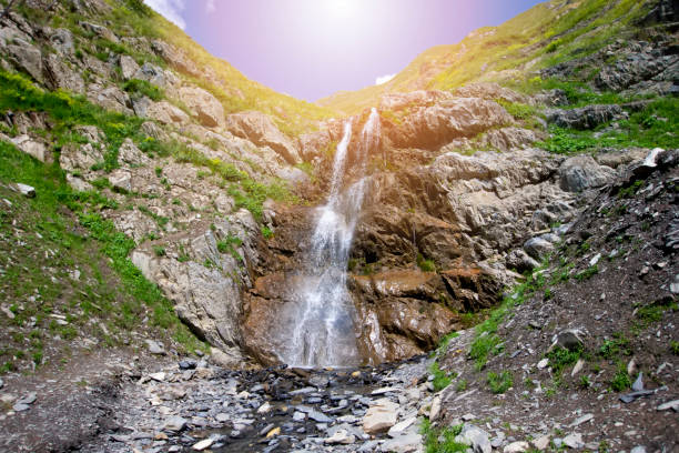 istock Beautiful waterfall on the mountain with blue sky Waterfall in tropical highlands. 1444966546