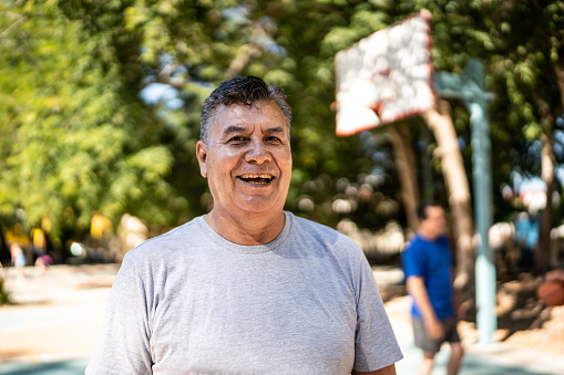 Portrait of mature man at the basketball court