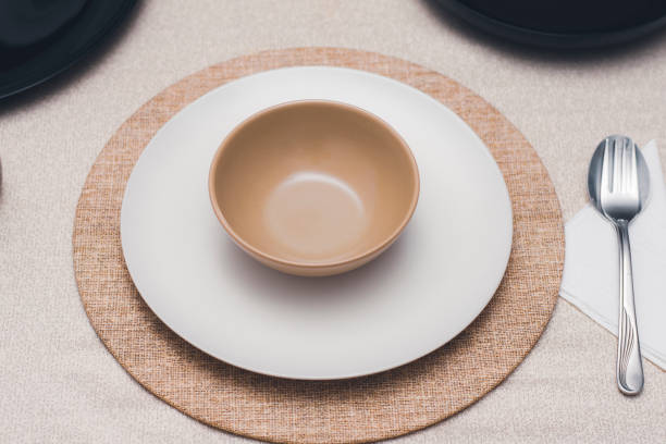 istock plate, spoon and glass arrangement on the dining table 1444967263