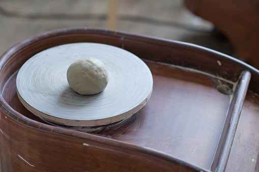 studio detail of a potter's wheel with cooked clay. workshop on the creation of clay dishes
