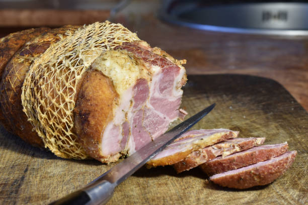 istock Ham cut into pieces on a cutting board. 1444968431