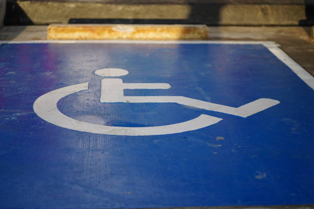 handicapped parking Handicapped parking spot.Disabled parking sign painted freshly painted road markings stock pictures, royalty-free photos & images