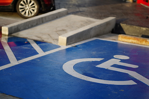 Handicapped parking spot.Disabled parking sign painted