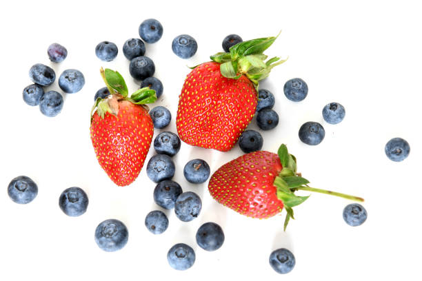 Sliced strawberries and whole blueberries.