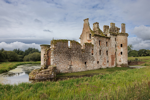 Caerlaverock Castle is a moated triangular castle first built in the 13th century