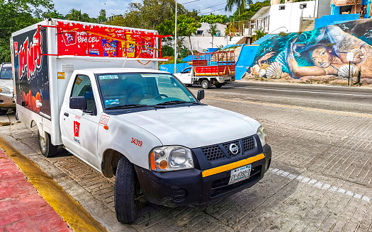 Various Mexican pickup trucks cars 4x4 Off-road vehicles in Puerto Escondido zicatela Oaxaca Mexico.