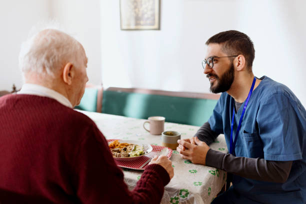 istock Home caregiver caring for a senior man 1444971924