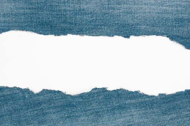 Torn edge grunge denim material   on a white  background