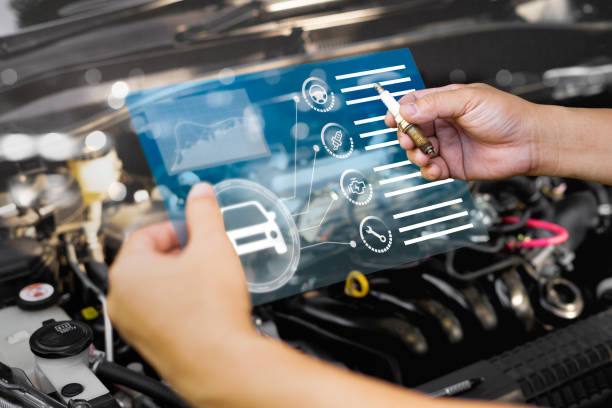 istock Technician holding Old spark plug and analyze the symptoms of engine damage with modern technology on a virtual screen and replacing parts efficiently, engine room in the background 1444973502