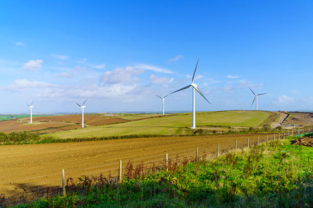 View of wind turbines farm and countryside, in Cornwall, England, UK