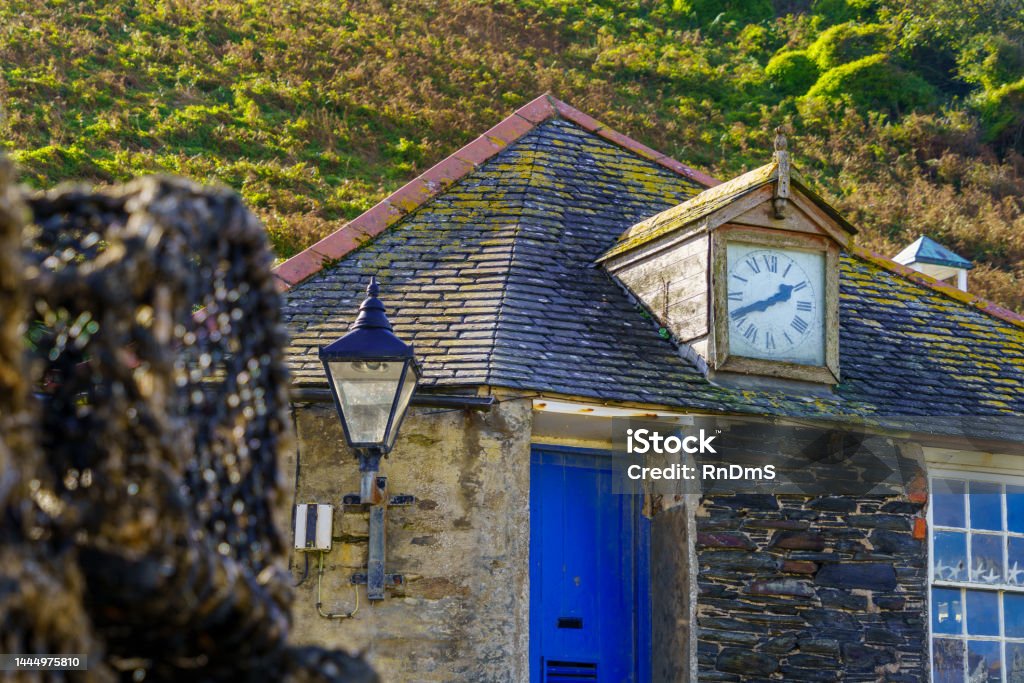 Building with clock in the port of Port Isaac View of building with clock in the port of Port Isaac, in Cornwall, England, UK Autumn Stock Photo