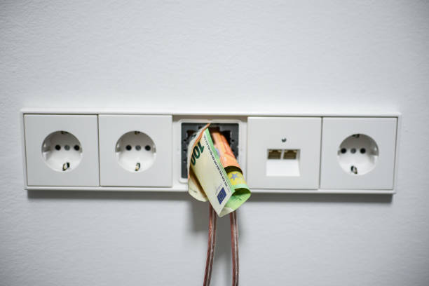 istock Socket and money indoors, white wall 1444975929