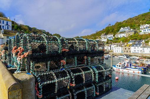 View of lobster traps in the fishing port of the village Polperro, in Cornwall, England, UK