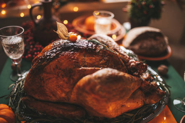 istock Thanksgiving holiday dinner table setting with fall decoration and pumpkins 1444976165