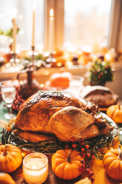 istock Thanksgiving holiday dinner table setting with fall decoration and pumpkins 1444976173