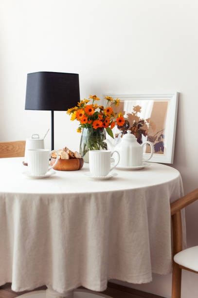 istock Served table for morning fresh tea with tablecloth and flowers 1444980167