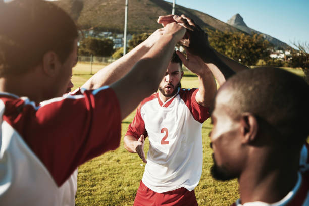 istock Men, soccer and team hands in collaboration, support and trust before a match or competition. Diversity, community and football group with motivation, support and teamwork for sports game on a field 1444982688