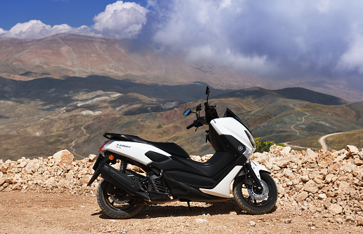 Turkey, Kemer 18.08.2022:Scooter white Yamaha NMAX 155 model 2020. The scooter is parked in the mountains of Turkey.