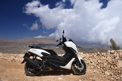 Turkey, Kemer 18.08.2022:Scooter white Yamaha NMAX 155 model 2020. The scooter is parked in the mountains of Turkey.