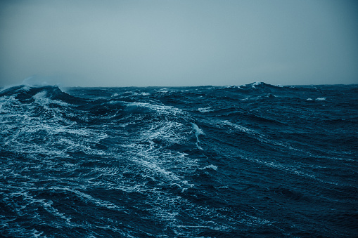 View on a rough sea, with waves of the open ocean from a boat. Dramatic landscapes of the Atlantic Ocean.