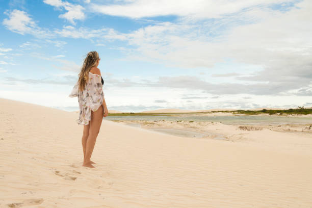 istock Woman on jericoacoara dune at sunset. 1444985629