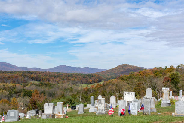 Conicville, Virginia - October 23, 2022 - A church graveyard with new and ancient tombstones in the Shenandoah Valley on an autumn afternoon.