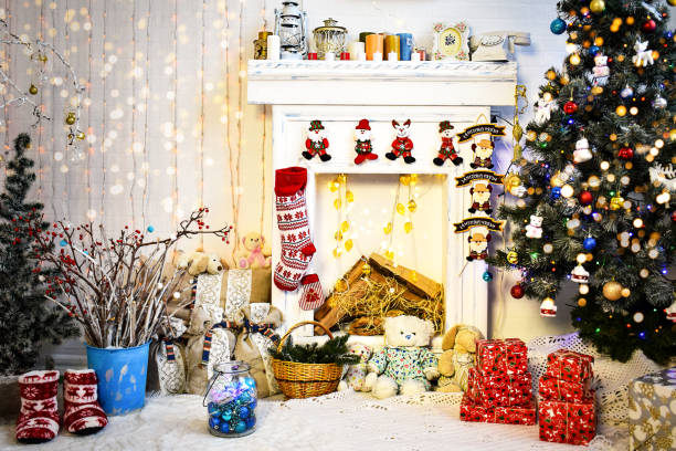 istock Christmas and New Year interior with blurry lights with Christmas tree and fireplace 1444989071