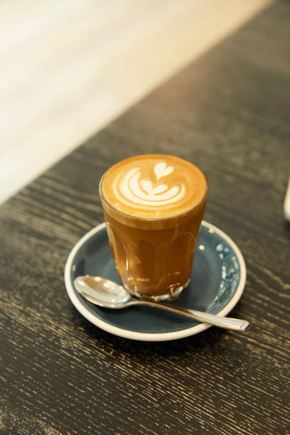 istock Coffee latte on wooden table. 1444989464