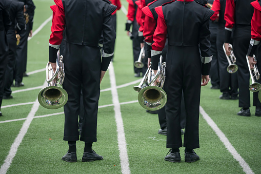 Newark, Delaware, USA - October 22, 2022: Marching Band tuba section performing at a Delaware University Blue Hens Football Game.