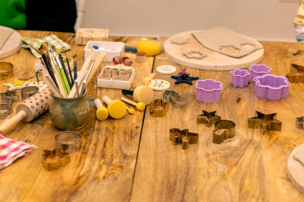 istock Work table of a Christmas pottery workshop. Tools and molds to make Christmas ornaments. 1444995249