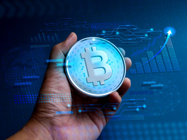Bitcoin, digital assets in the hand with tech graphics, business growth graph, global icon on blue cyberspace, blockchain background, future financial, crypto currency, investment technology concepts.