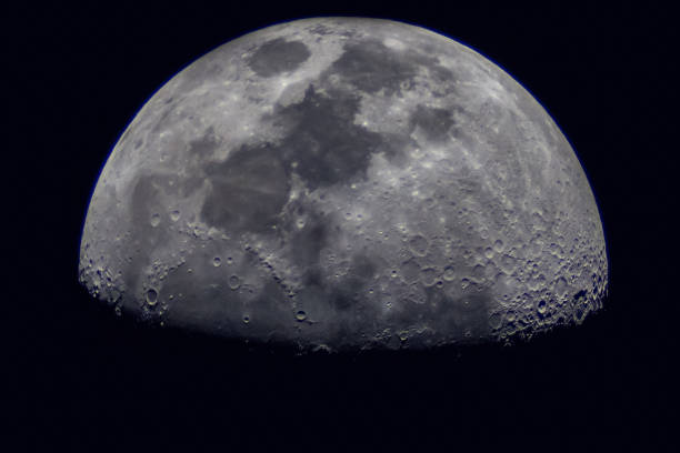 istock Surface of the Moon on black background, close up. 1444997244