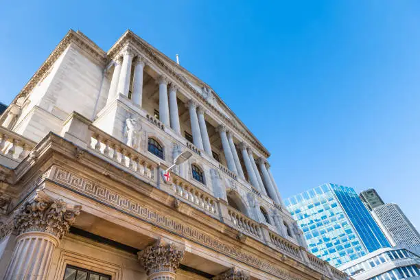 Photo of Looking up view on Governor and Company of Bank of England, Great Britain or United Kingdom central bank monetary authority in city of London