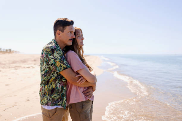 istock Couple in love embracing on the beach 1445002254