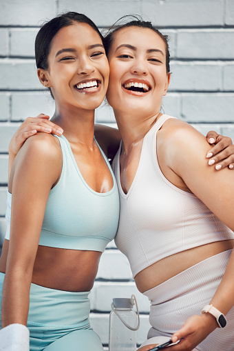Healthy, exercise and friends smile after a workout or yoga training outdoor. Portrait of happy women smile, hug and laugh with cardio and fitness, excited and active at health and wellness club