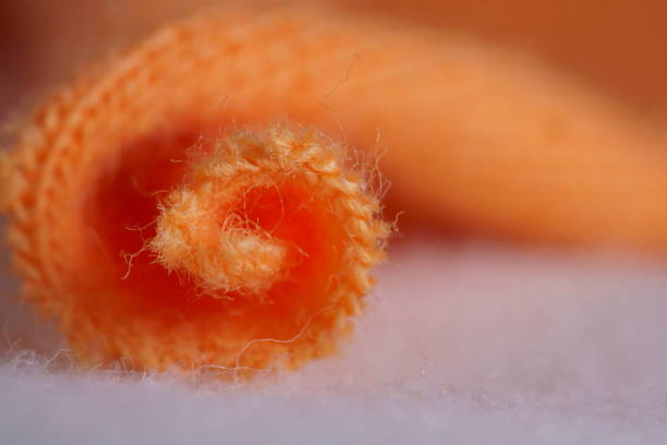 Macro photography with textile used to make t-shirts; texture background; textile industry background.