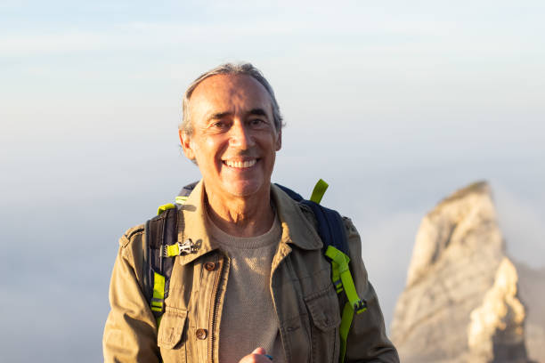 istock Portrait of elderly man at mountain peak 1445010082