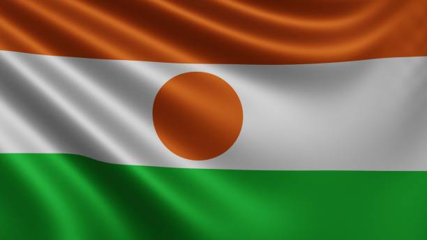 rendu du drapeau du niger flotte dans le vent en gros plan, le drapeau national du niger flotte en résolution 4k, gros plan, couleurs: rgb. - niger delta photos et images de collection