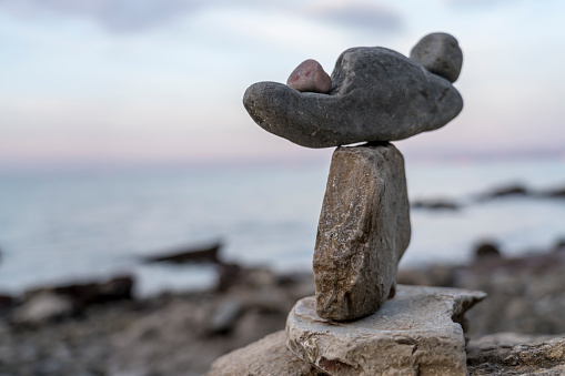 Close up of stacked stones against the sea, Strunjan cliff, Adriatic sea, Slovenia
