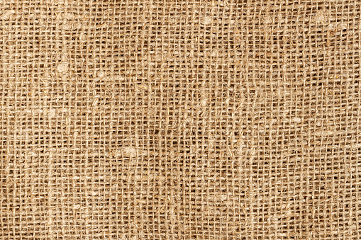 Natural textured sacking burlap background. Hessian sack canvas woven texture closeup