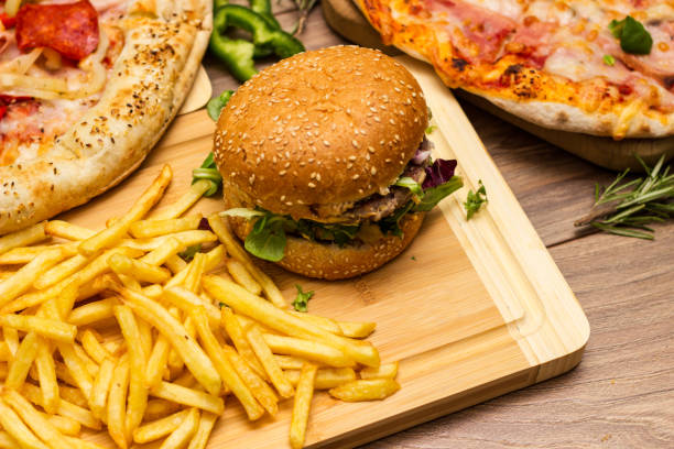 istock Pizza and hamburger on wooden background 1445013692