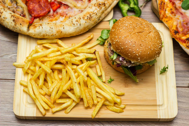istock Pizza and hamburger on wooden background 1445013735