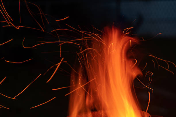 istock Sparks and Embers fly off the fire at dusk 1445013819