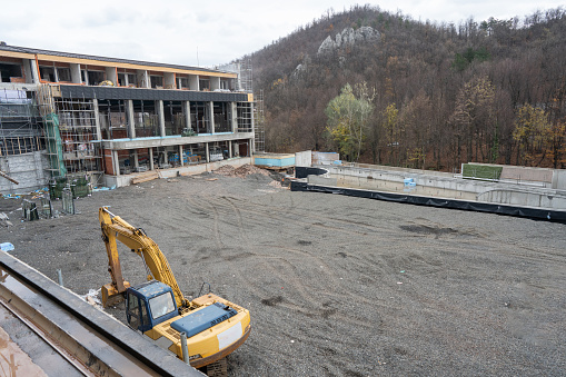 Construction site for a new commercial building complex on a mountain.