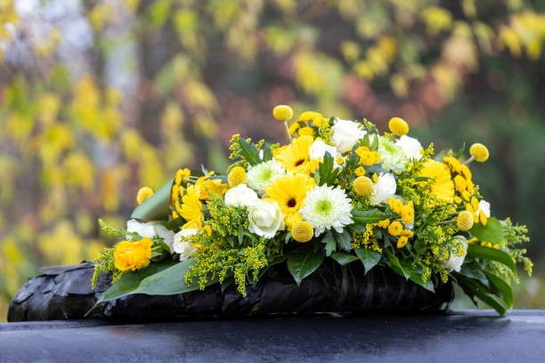 Funeral wreath with yellow and white flowers stock photo